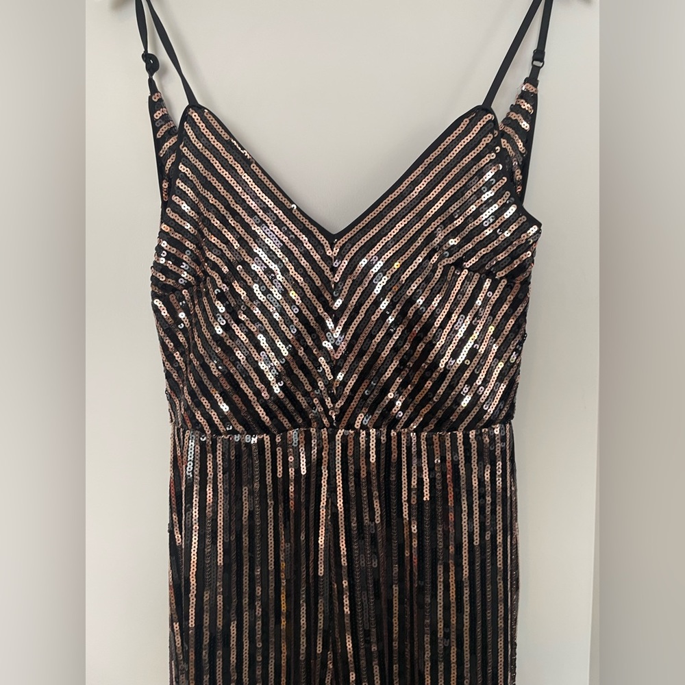 Gorgeous gold/black sequence jumpsuit!! Excellent condition. New without tags.